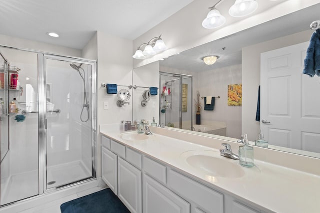122 Seascape Dr Unit 701, Miramar Beach, FL 32550 - full bath featuring a shower stall, double vanity, a garden tub, and a sink