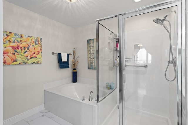 122 Seascape Dr Unit 701, Miramar Beach, FL 32550 - full bathroom with a shower stall, marble finish floor, baseboards, and a garden tub