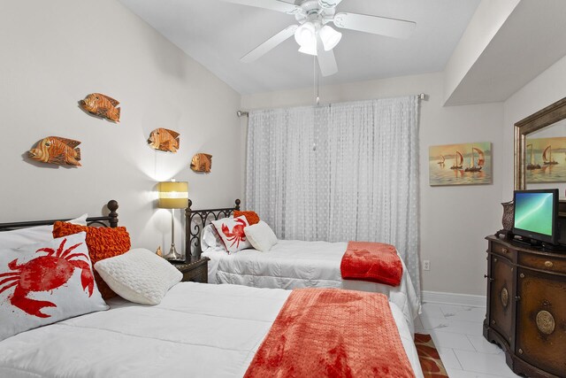 122 Seascape Dr Unit 701, Miramar Beach, FL 32550 - bedroom featuring marble finish floor, baseboards, and a ceiling fan