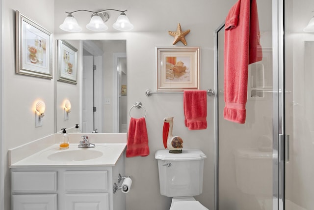 122 Seascape Dr Unit 701, Miramar Beach, FL 32550 - bathroom with a shower stall, vanity, and toilet
