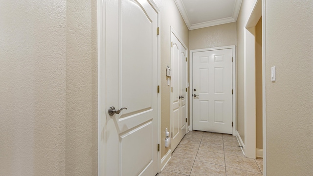 554 Magnolia Lake Dr, Defuniak Springs, FL 32433 - hall with a textured wall, crown molding, and light tile patterned floors