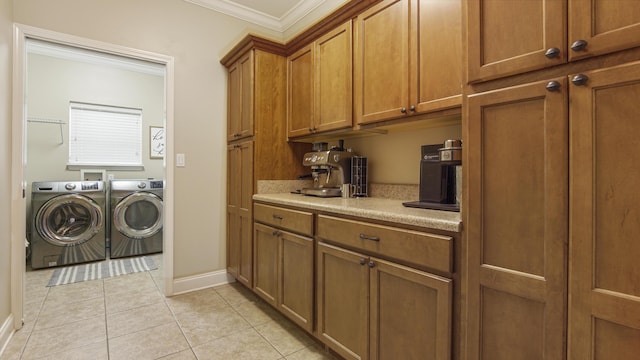 554 Magnolia Lake Dr, Defuniak Springs, FL 32433 - laundry room with separate washer and dryer, crown molding, light tile patterned floors, and baseboards