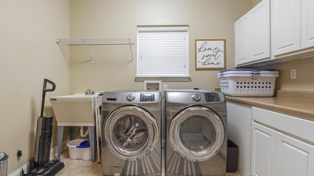554 Magnolia Lake Dr, Defuniak Springs, FL 32433 - laundry area with cabinet space, washing machine and clothes dryer, and light tile patterned flooring