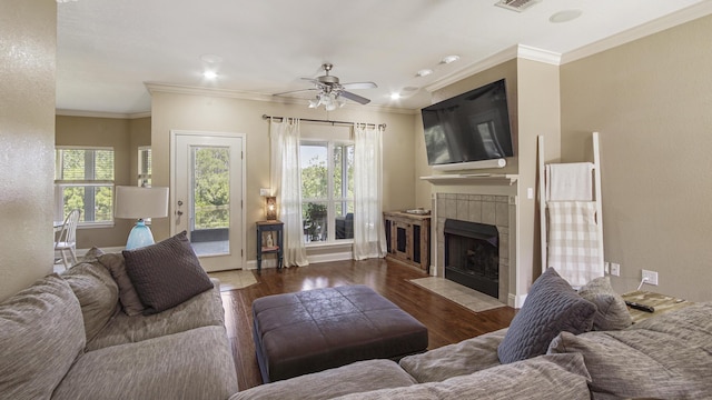 554 Magnolia Lake Dr, Defuniak Springs, FL 32433 - living area featuring plenty of natural light, a fireplace, crown molding, and wood finished floors