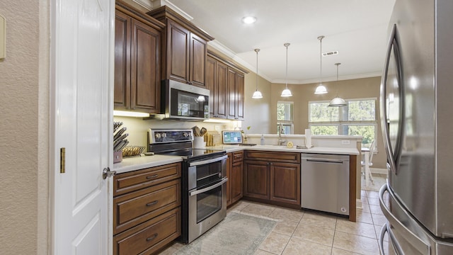 554 Magnolia Lake Dr, Defuniak Springs, FL 32433 - kitchen with stainless steel appliances, a sink, a peninsula, crown molding, and light countertops