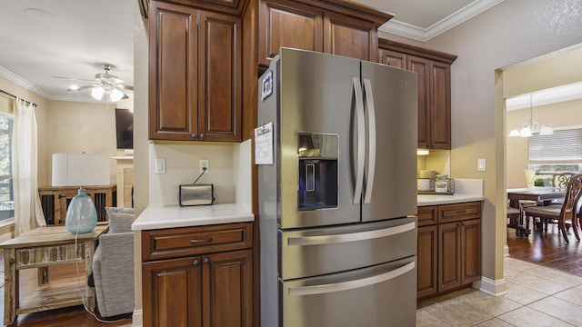 554 Magnolia Lake Dr, Defuniak Springs, FL 32433 - kitchen featuring stainless steel refrigerator with ice dispenser, plenty of natural light, a ceiling fan, crown molding, and light countertops