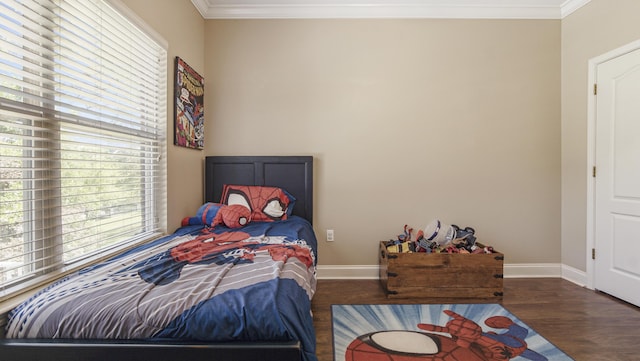 554 Magnolia Lake Dr, Defuniak Springs, FL 32433 - bedroom featuring crown molding, wood finished floors, and baseboards