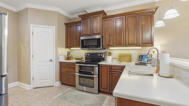 554 Magnolia Lake Dr, Defuniak Springs, FL 32433 - kitchen with appliances with stainless steel finishes, a sink, light countertops, light tile patterned floors, and crown molding
