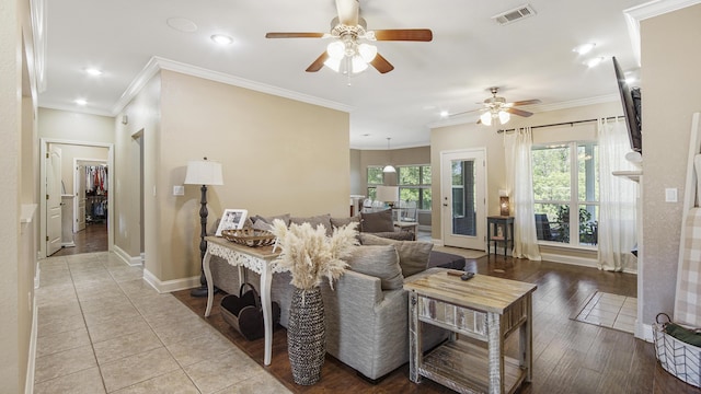 554 Magnolia Lake Dr, Defuniak Springs, FL 32433 - living room featuring a ceiling fan, recessed lighting, crown molding, baseboards, and wood finished floors