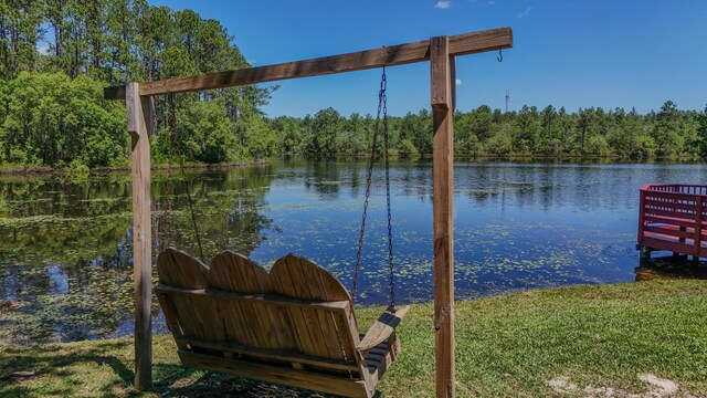 554 Magnolia Lake Dr, Defuniak Springs, FL 32433 - dock area featuring a water view and a wooded view
