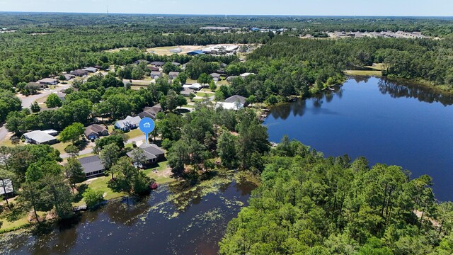 554 Magnolia Lake Dr, Defuniak Springs, FL 32433 - view of property location with a heavily wooded area, a nearby body of water, and nearby suburban area