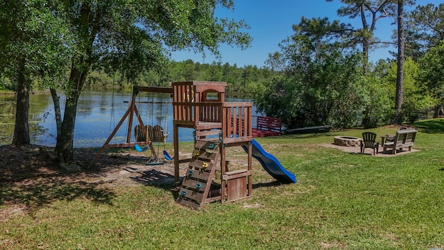 554 Magnolia Lake Dr, Defuniak Springs, FL 32433 - view of playground with a fire pit, a yard, and a water view
