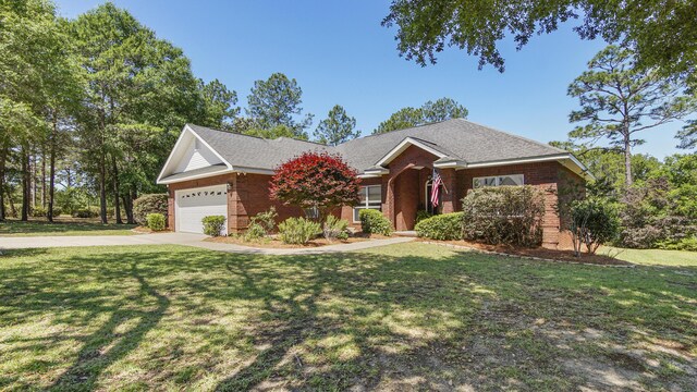 554 Magnolia Lake Dr, Defuniak Springs, FL 32433 - ranch-style home with concrete driveway, a garage, brick siding, and a front yard