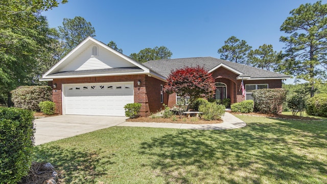 554 Magnolia Lake Dr, Defuniak Springs, FL 32433 - view of front facade with brick siding, driveway, a front lawn, and an attached garage