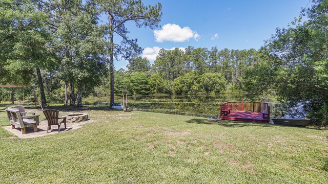 554 Magnolia Lake Dr, Defuniak Springs, FL 32433 - view of grassy yard with a fire pit and a deck