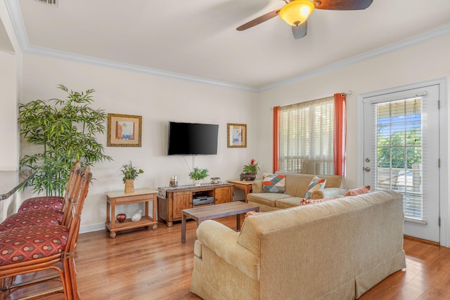 387 Twin Lakes Ln, Destin, FL 32541 - living room with light wood finished floors, ceiling fan, and crown molding