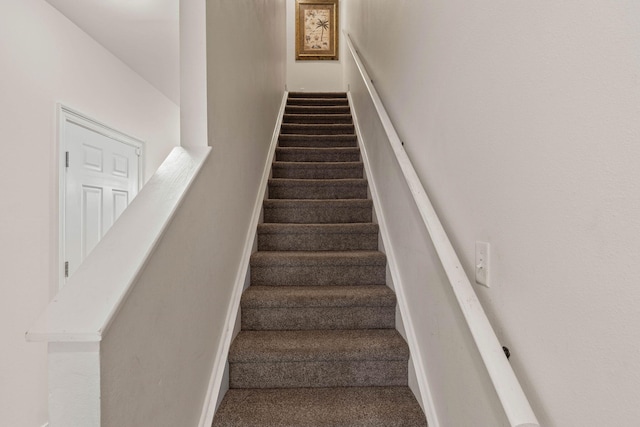 387 Twin Lakes Ln, Destin, FL 32541 - staircase featuring carpet and baseboards