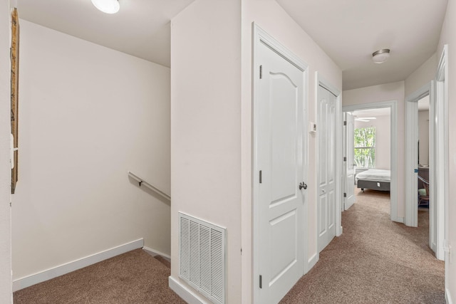 387 Twin Lakes Ln, Destin, FL 32541 - hallway featuring an upstairs landing, carpet, and baseboards