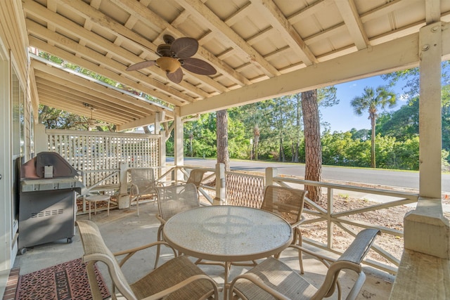 387 Twin Lakes Ln, Destin, FL 32541 - view of patio / terrace featuring ceiling fan, a grill, outdoor dining area, and view of wooded area