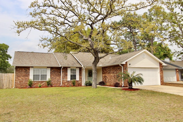 206 Secretariat Dr, Crestview, FL 32539 - ranch-style house with fence, a front lawn, brick siding, a garage, and concrete driveway
