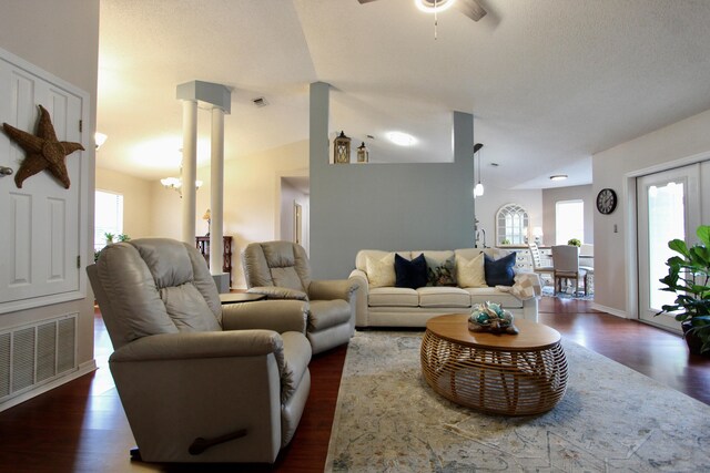 206 Secretariat Dr, Crestview, FL 32539 - living area featuring visible vents, a ceiling fan, dark wood-type flooring, and a healthy amount of sunlight