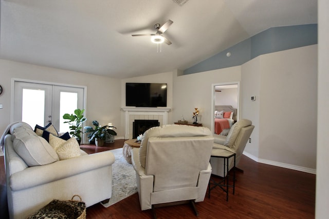 206 Secretariat Dr, Crestview, FL 32539 - living area featuring ceiling fan, french doors, a tile fireplace, vaulted ceiling, and dark wood-style floors