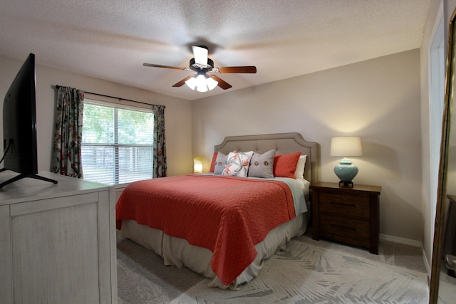206 Secretariat Dr, Crestview, FL 32539 - bedroom featuring light colored carpet, a ceiling fan, baseboards, and a textured ceiling