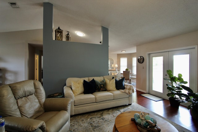 206 Secretariat Dr, Crestview, FL 32539 - living area with french doors, visible vents, and wood finished floors