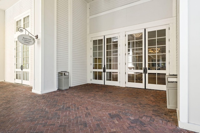 unfurnished sunroom with french doors