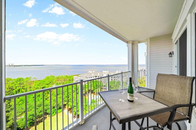 balcony featuring a water view