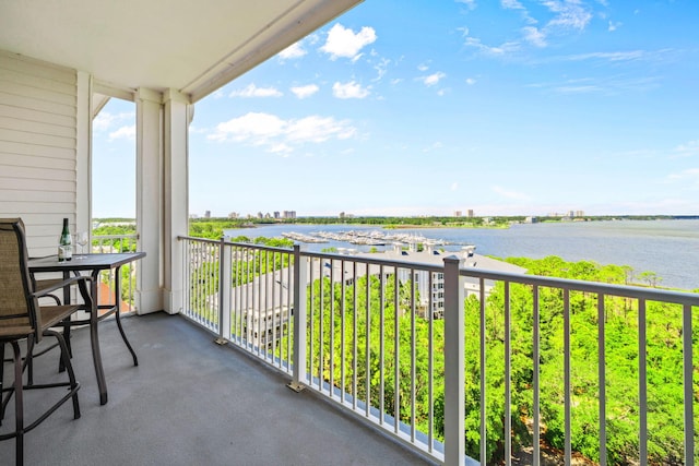 balcony featuring a water view