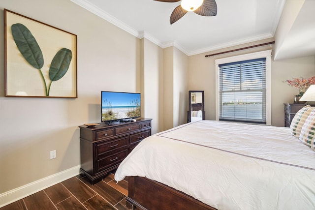 bedroom featuring baseboards, dark wood finished floors, crown molding, and a ceiling fan