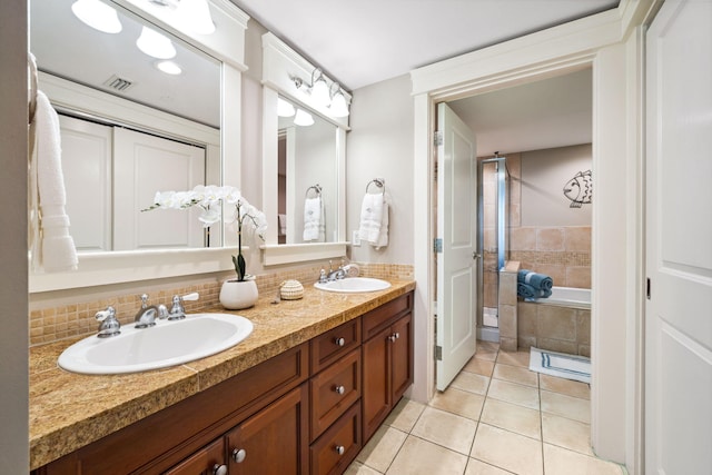 full bathroom with a shower stall, tile patterned floors, double vanity, tiled tub, and decorative backsplash