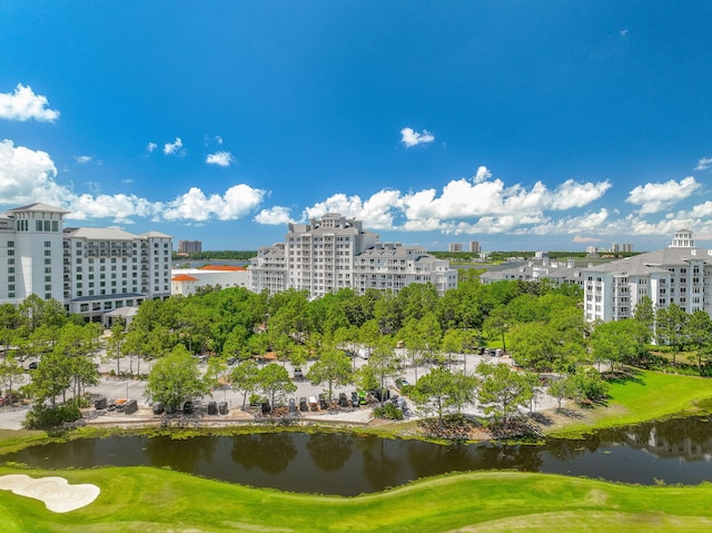 view of property's community featuring golf course view and a water view