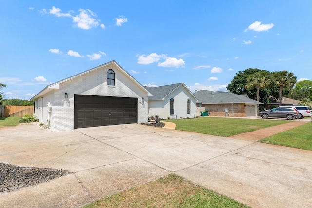 197 Kel-Wen Circle Kel-Wen, Destin, FL 32541 - view of front of property with brick siding, a garage, and concrete driveway