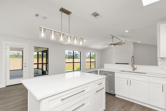 197 Kel-Wen Circle Kel-Wen, Destin, FL 32541 - kitchen featuring stainless steel dishwasher, a sink, light countertops, light wood-type flooring, and plenty of natural light