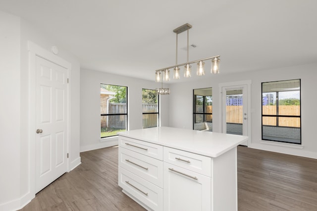 197 Kel-Wen Circle Kel-Wen, Destin, FL 32541 - kitchen featuring light wood-style flooring, light countertops, white cabinets, pendant lighting, and a kitchen island
