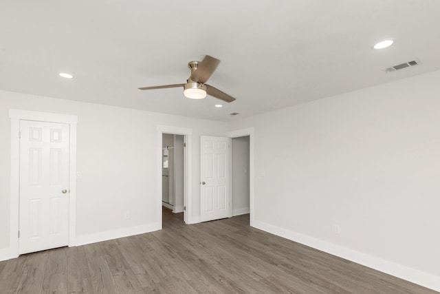 197 Kel-Wen Circle Kel-Wen, Destin, FL 32541 - unfurnished bedroom with baseboards, wood finished floors, recessed lighting, and a ceiling fan