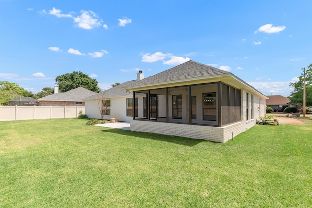 197 Kel-Wen Circle Kel-Wen, Destin, FL 32541 - back of property featuring a sunroom, roof with shingles, a chimney, and brick siding