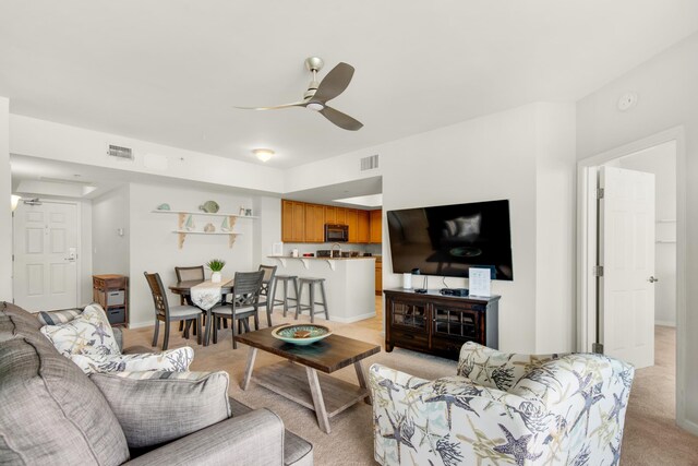 4203 Indian Bayou Trl Unit 1716, Destin, FL 32541 - living room featuring baseboards, visible vents, light colored carpet, and a ceiling fan