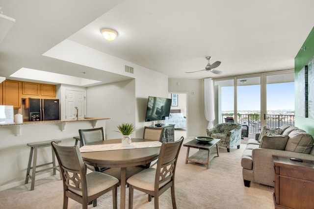 4203 Indian Bayou Trl Unit 1716, Destin, FL 32541 - dining area with light carpet, ceiling fan, and visible vents