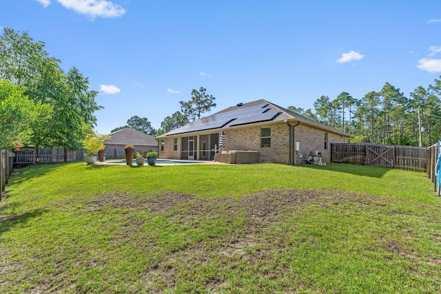 7045 Leisure St, Navarre, FL 32566 - rear view of house featuring a sunroom, solar panels, and brick siding