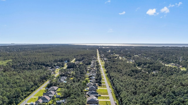 7045 Leisure St, Navarre, FL 32566 - aerial perspective of suburban area featuring a heavily wooded area