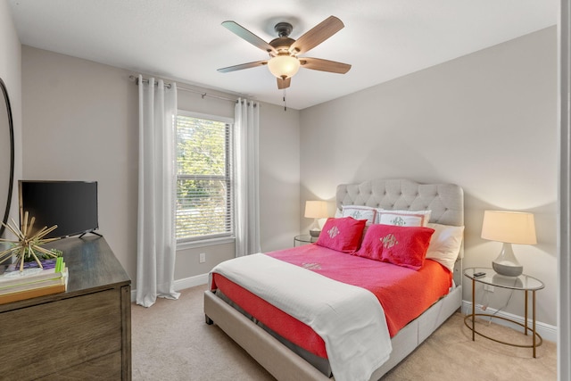 7045 Leisure St, Navarre, FL 32566 - bedroom with light colored carpet, baseboards, and ceiling fan