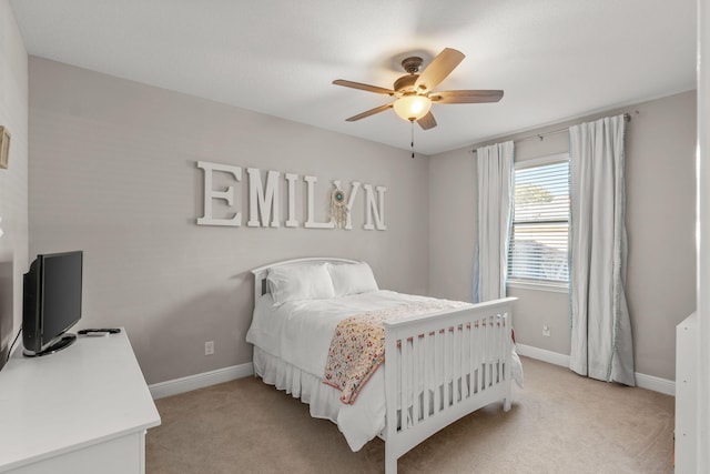 7045 Leisure St, Navarre, FL 32566 - bedroom with light carpet, baseboards, and ceiling fan