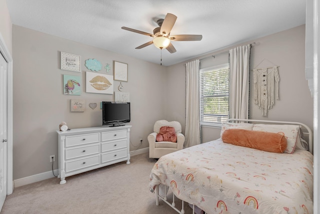 7045 Leisure St, Navarre, FL 32566 - bedroom featuring light colored carpet, baseboards, and a ceiling fan