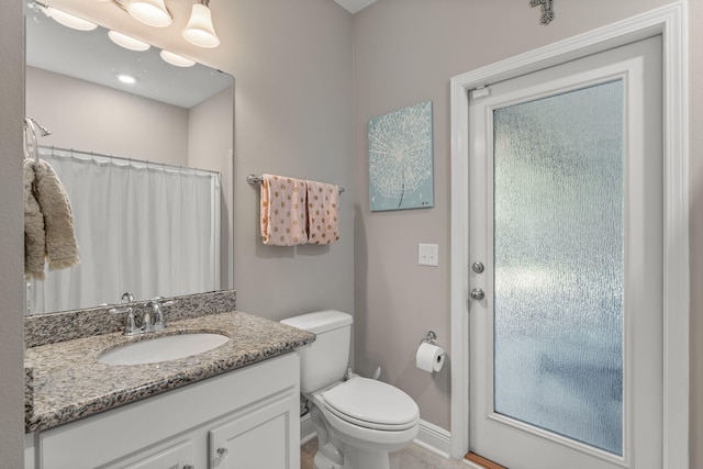 7045 Leisure St, Navarre, FL 32566 - full bath featuring vanity, toilet, baseboards, and a shower with shower curtain