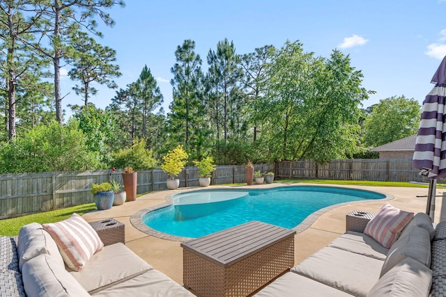 7045 Leisure St, Navarre, FL 32566 - view of pool featuring an outdoor hangout area, a patio, and a fenced backyard