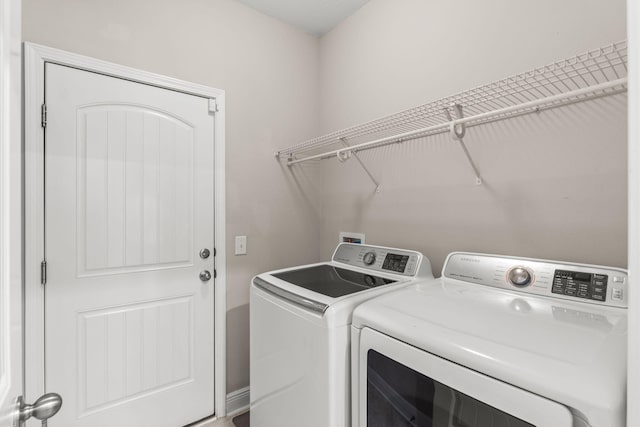 7045 Leisure St, Navarre, FL 32566 - laundry area with washer and clothes dryer