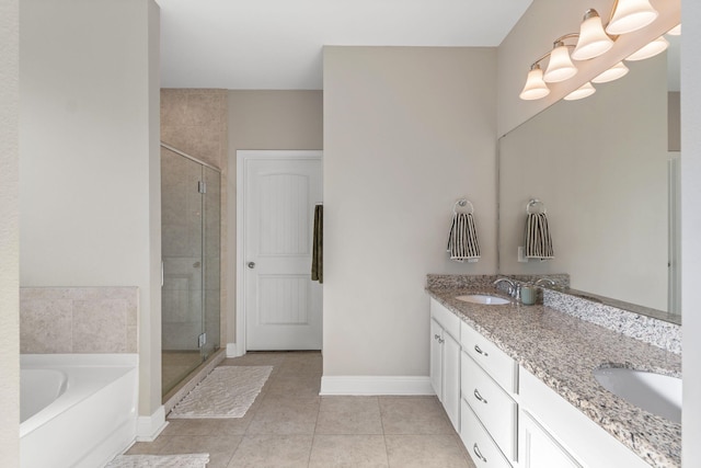 7045 Leisure St, Navarre, FL 32566 - full bath featuring a shower stall, tile patterned flooring, a garden tub, and double vanity
